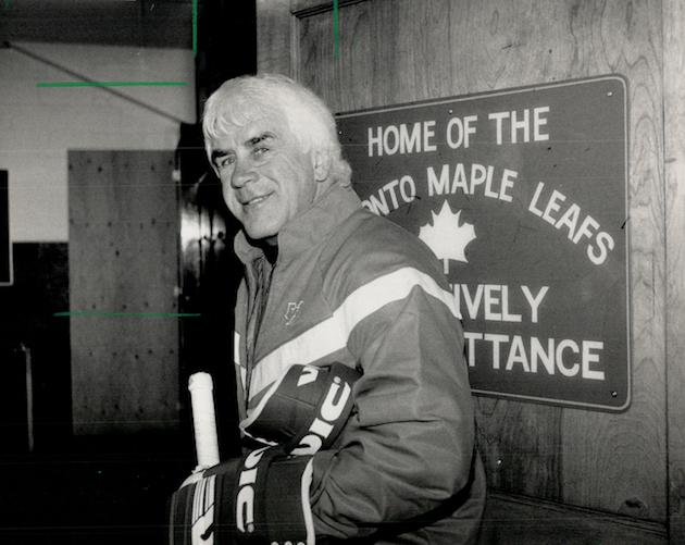 Why the smile?: Coach John Brophy of the Maple Leafs gave a broad smile yesterday as he left the Gar