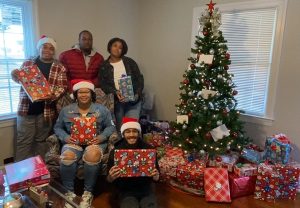 Family at tree with gifts