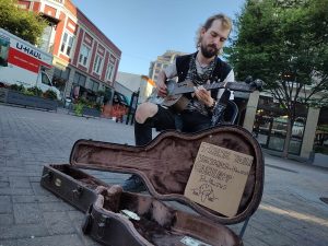 busker - guitar guy